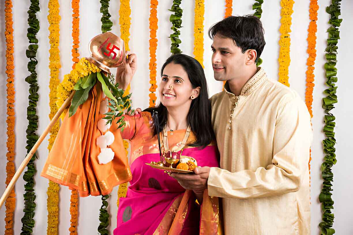 Spiritual pooja photoshoot with symbolic swastik drawn on lota